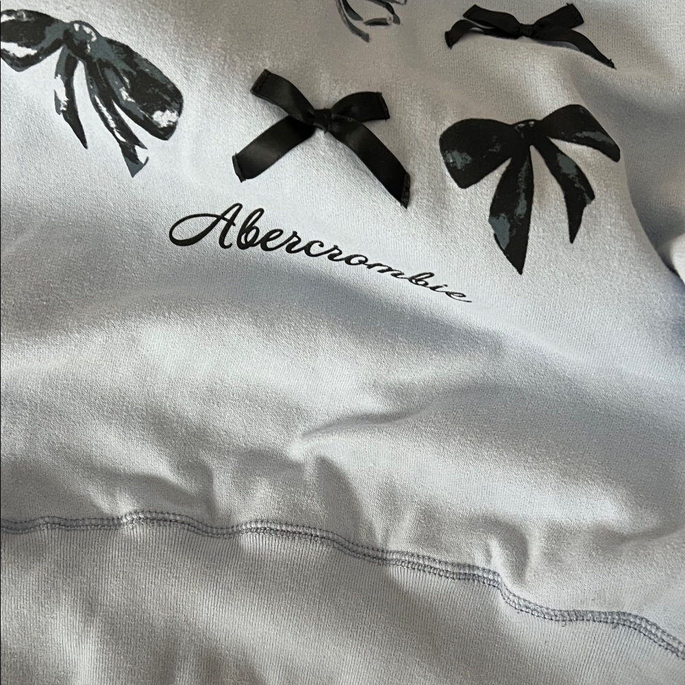 Abercrombie Kids Light Blue Hoodie with Black Bow Design 13/14 - Picture 4 of 5
